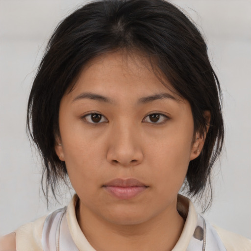 Neutral asian young-adult female with medium  brown hair and brown eyes