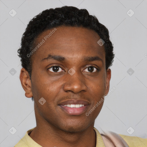 Joyful black young-adult male with short  brown hair and brown eyes