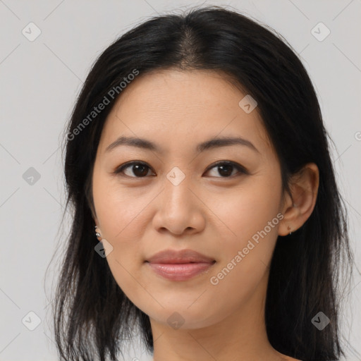 Joyful asian young-adult female with long  brown hair and brown eyes