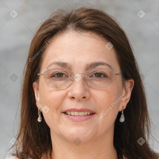 Joyful white adult female with long  brown hair and brown eyes