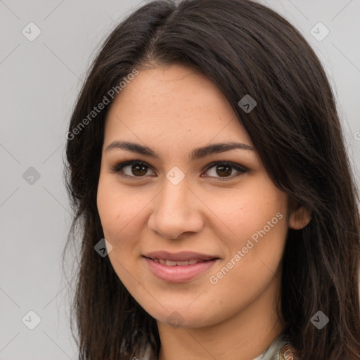 Joyful latino young-adult female with long  brown hair and brown eyes