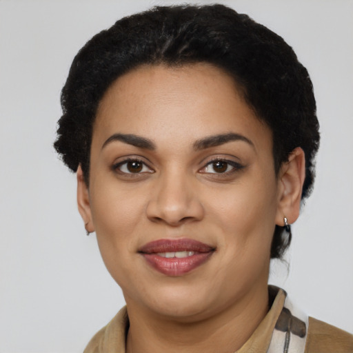 Joyful latino young-adult female with short  black hair and brown eyes