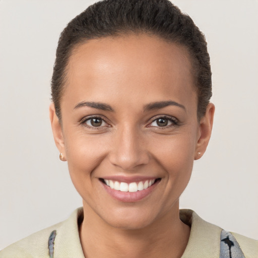 Joyful white young-adult female with short  brown hair and brown eyes