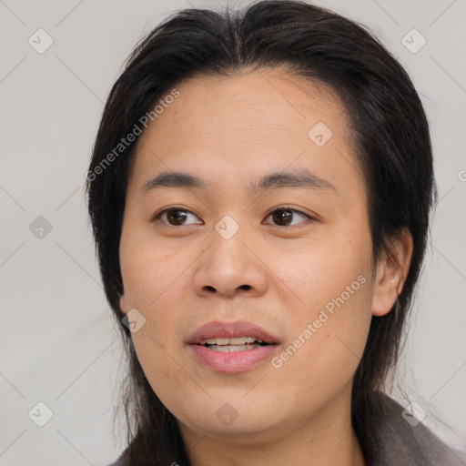 Joyful asian young-adult female with medium  brown hair and brown eyes