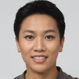 Joyful asian young-adult female with short  black hair and brown eyes