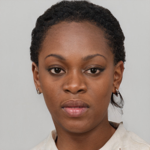 Neutral black young-adult female with short  black hair and brown eyes