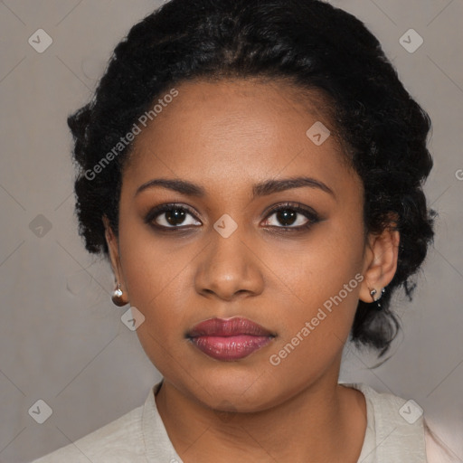 Joyful black young-adult female with medium  black hair and brown eyes