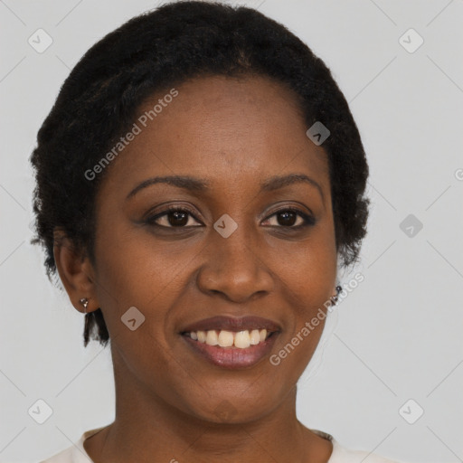 Joyful black young-adult female with short  brown hair and brown eyes