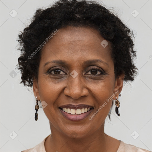 Joyful black adult female with short  brown hair and brown eyes