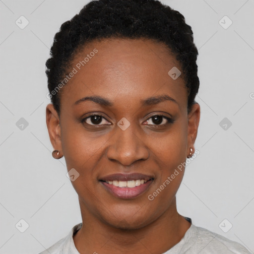 Joyful black young-adult female with short  black hair and brown eyes