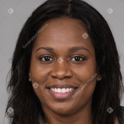 Joyful black young-adult female with long  brown hair and brown eyes