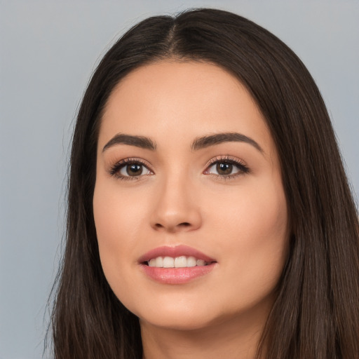 Joyful white young-adult female with long  brown hair and brown eyes