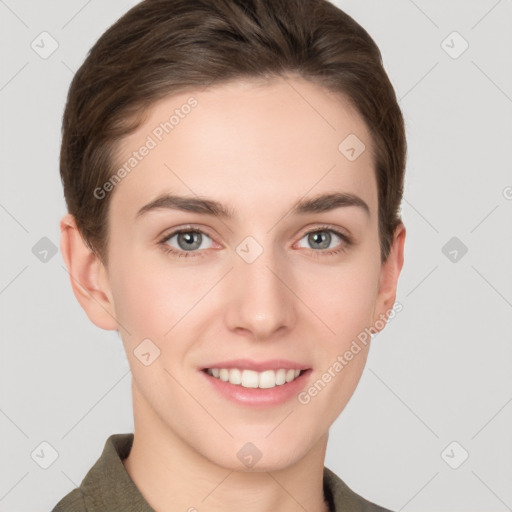 Joyful white young-adult female with short  brown hair and grey eyes