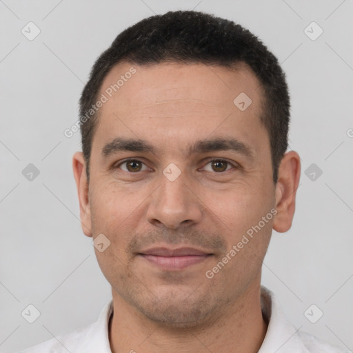 Joyful white adult male with short  brown hair and brown eyes