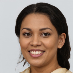 Joyful latino young-adult female with medium  brown hair and brown eyes