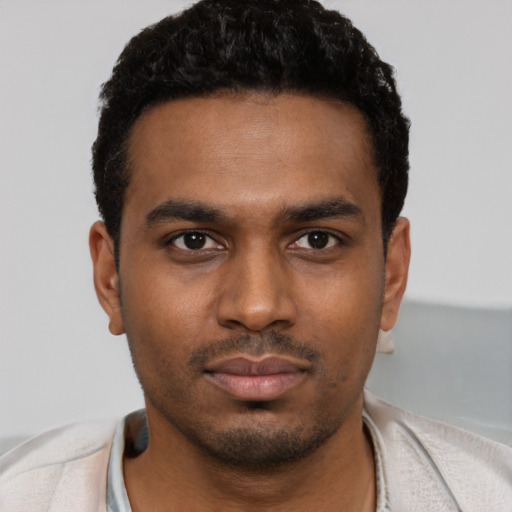 Neutral black young-adult male with short  black hair and brown eyes