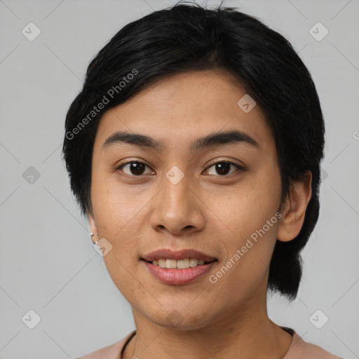 Joyful asian young-adult female with short  black hair and brown eyes