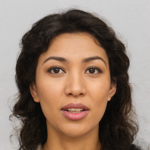 Joyful asian young-adult female with long  brown hair and brown eyes