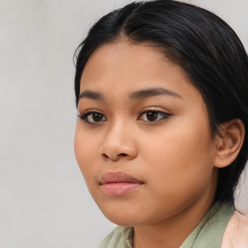 Neutral latino young-adult female with medium  black hair and brown eyes