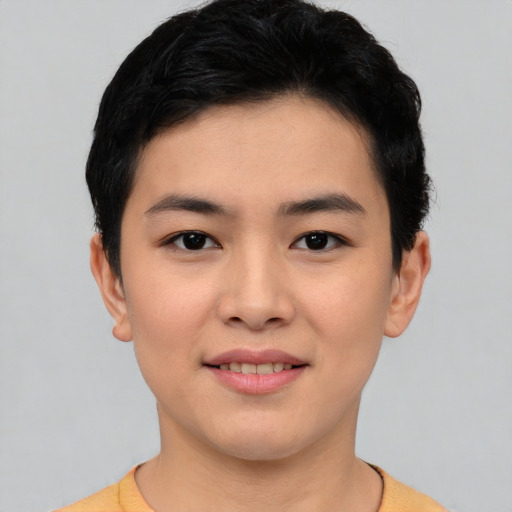 Joyful asian young-adult female with short  black hair and brown eyes