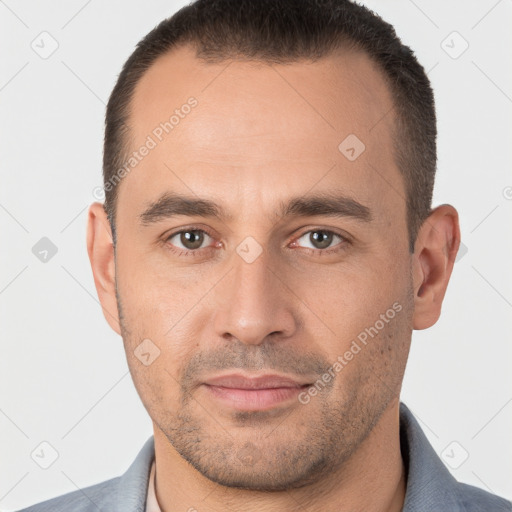 Joyful white young-adult male with short  brown hair and brown eyes