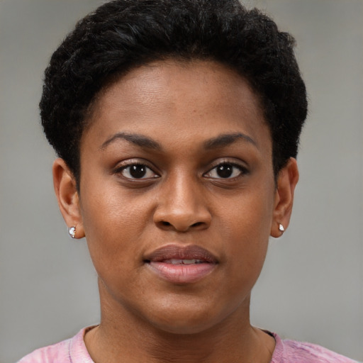 Joyful black young-adult female with short  brown hair and brown eyes