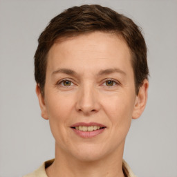 Joyful white adult female with short  brown hair and brown eyes