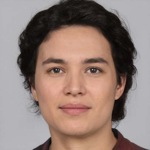 Joyful white young-adult male with medium  brown hair and brown eyes