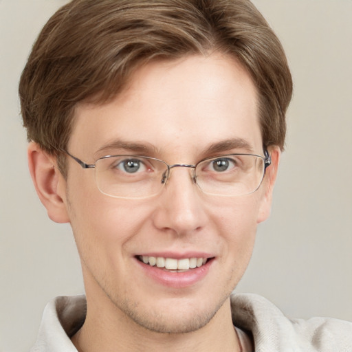 Joyful white adult male with short  brown hair and grey eyes