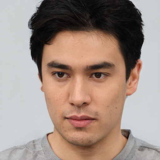 Neutral white young-adult male with short  black hair and brown eyes