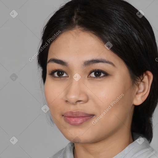 Joyful asian young-adult female with medium  black hair and brown eyes