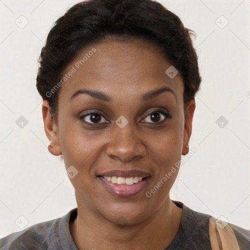 Joyful black young-adult female with short  brown hair and brown eyes