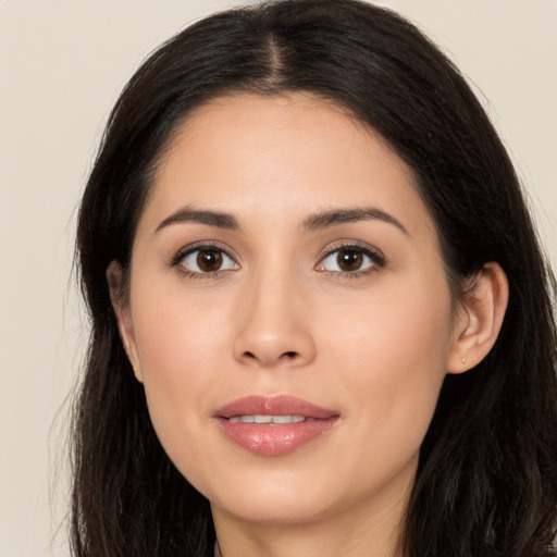 Joyful asian young-adult female with long  brown hair and brown eyes