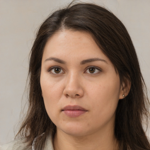 Neutral white young-adult female with long  brown hair and brown eyes