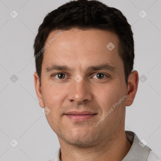 Joyful white young-adult male with short  brown hair and brown eyes