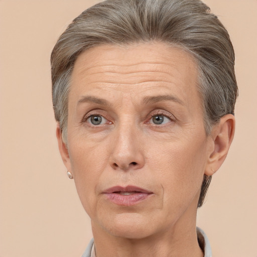 Neutral white middle-aged female with short  gray hair and brown eyes