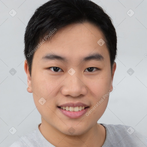 Joyful asian young-adult male with short  black hair and brown eyes