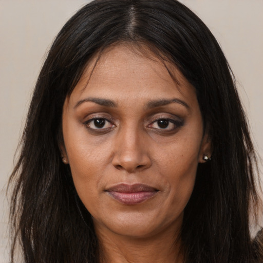 Joyful asian adult female with long  brown hair and brown eyes