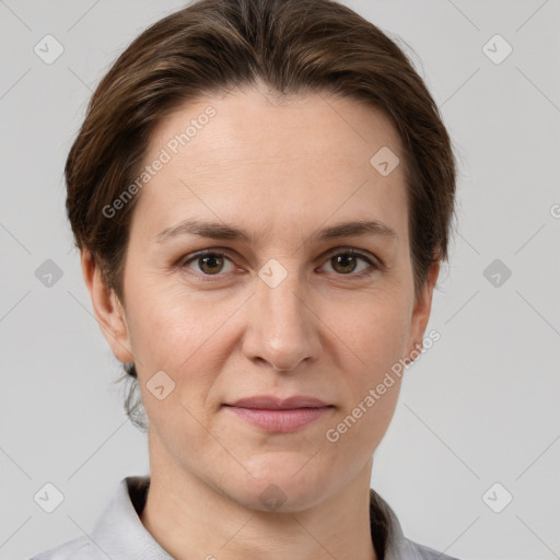 Joyful white adult female with short  brown hair and grey eyes