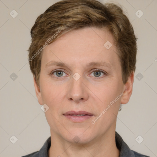 Joyful white adult female with short  brown hair and grey eyes