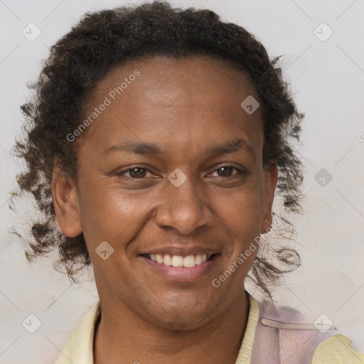 Joyful black adult female with short  brown hair and brown eyes