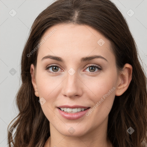 Joyful white young-adult female with long  brown hair and grey eyes