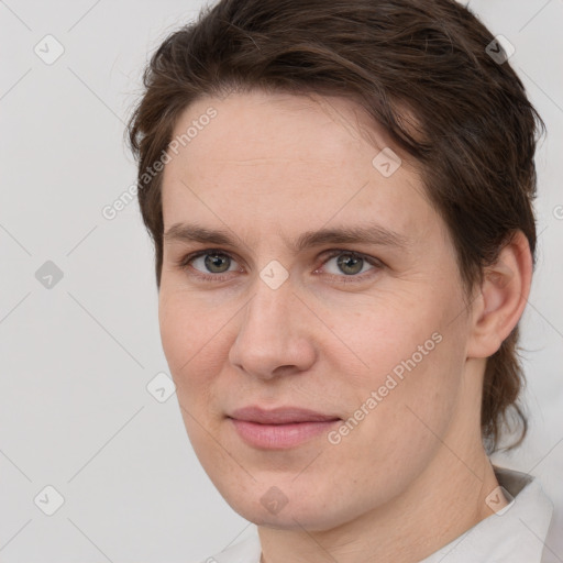 Joyful white adult female with short  brown hair and brown eyes