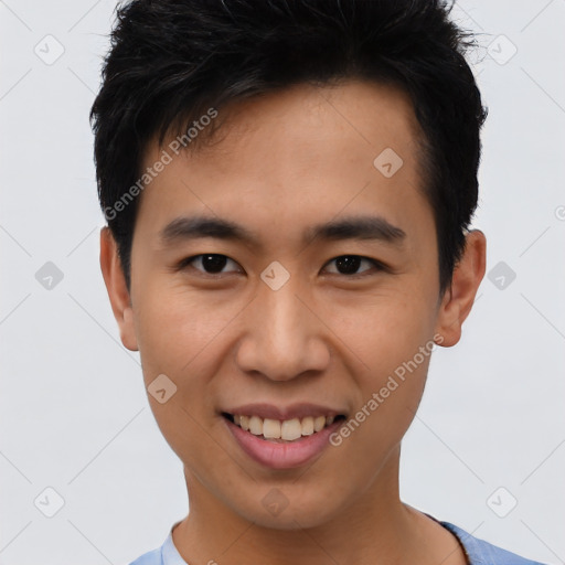 Joyful asian young-adult male with short  brown hair and brown eyes