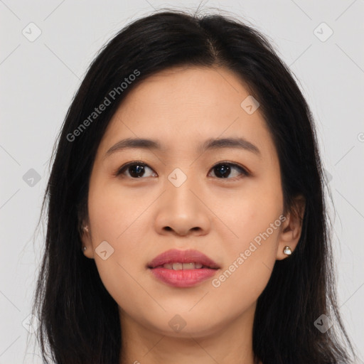 Joyful asian young-adult female with long  black hair and brown eyes