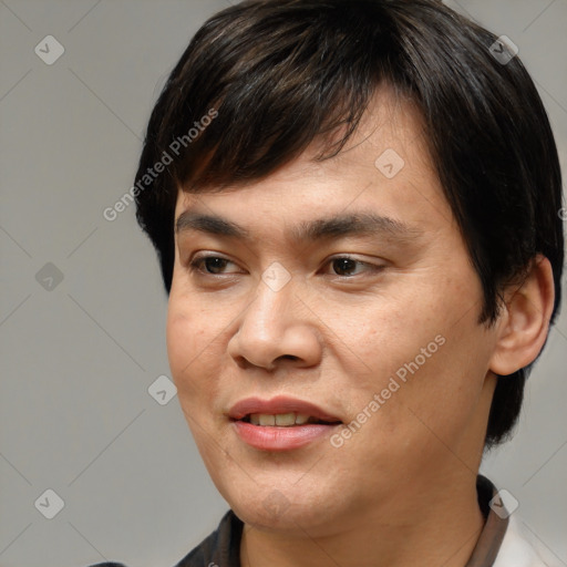 Joyful white young-adult male with medium  brown hair and brown eyes