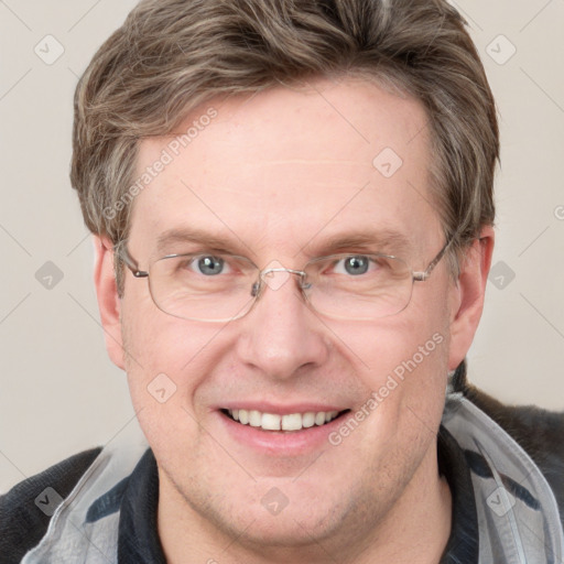 Joyful white adult male with short  brown hair and grey eyes