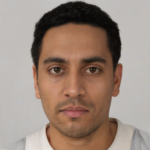Neutral latino young-adult male with short  black hair and brown eyes