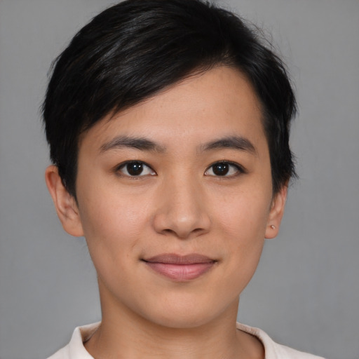Joyful asian young-adult female with short  black hair and brown eyes