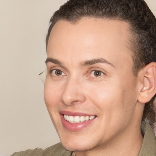 Joyful white adult female with short  brown hair and brown eyes